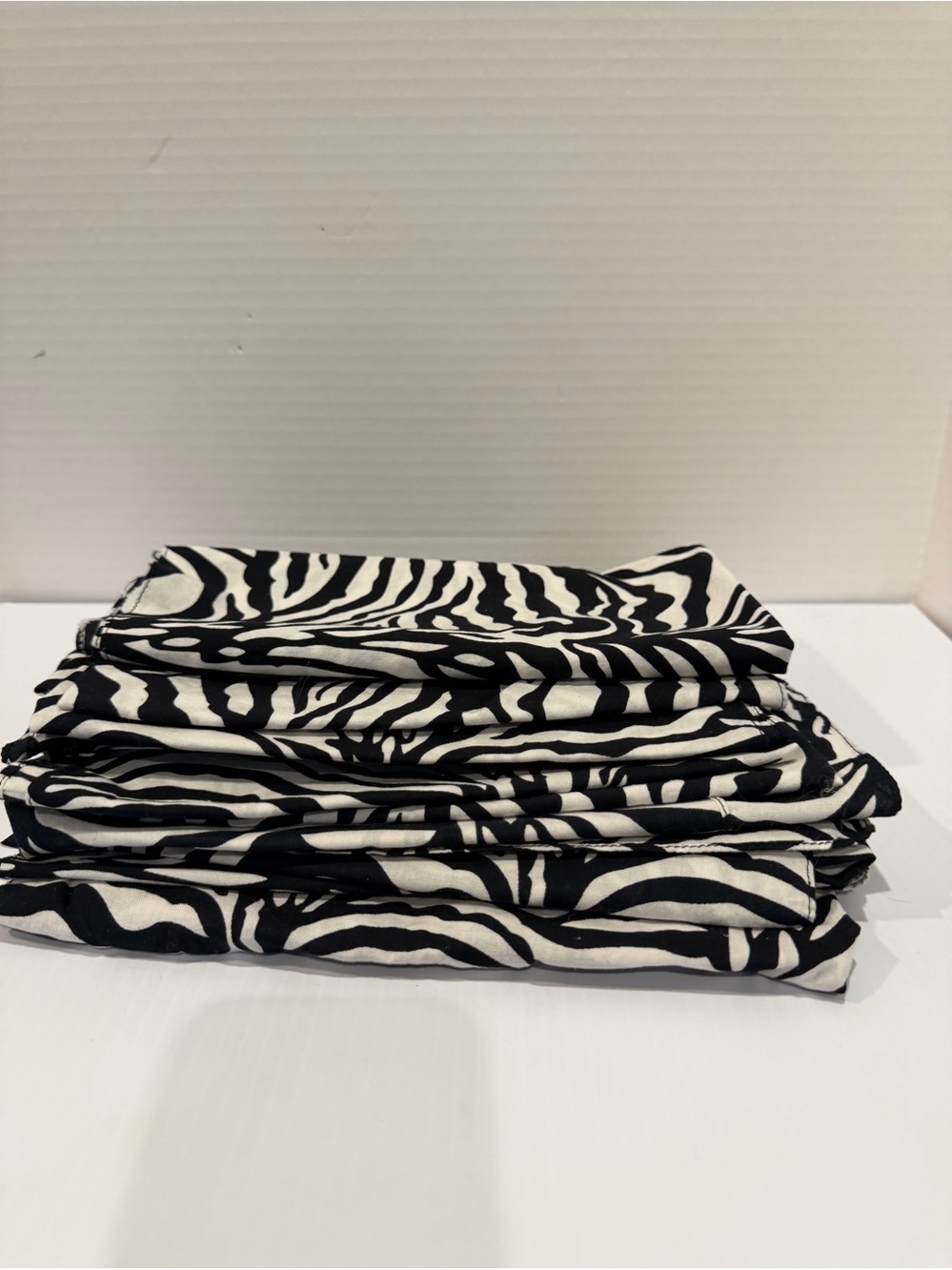 Set of 13 cotton 20x20” Zebra Print Napkins, Black & White, used for a party.